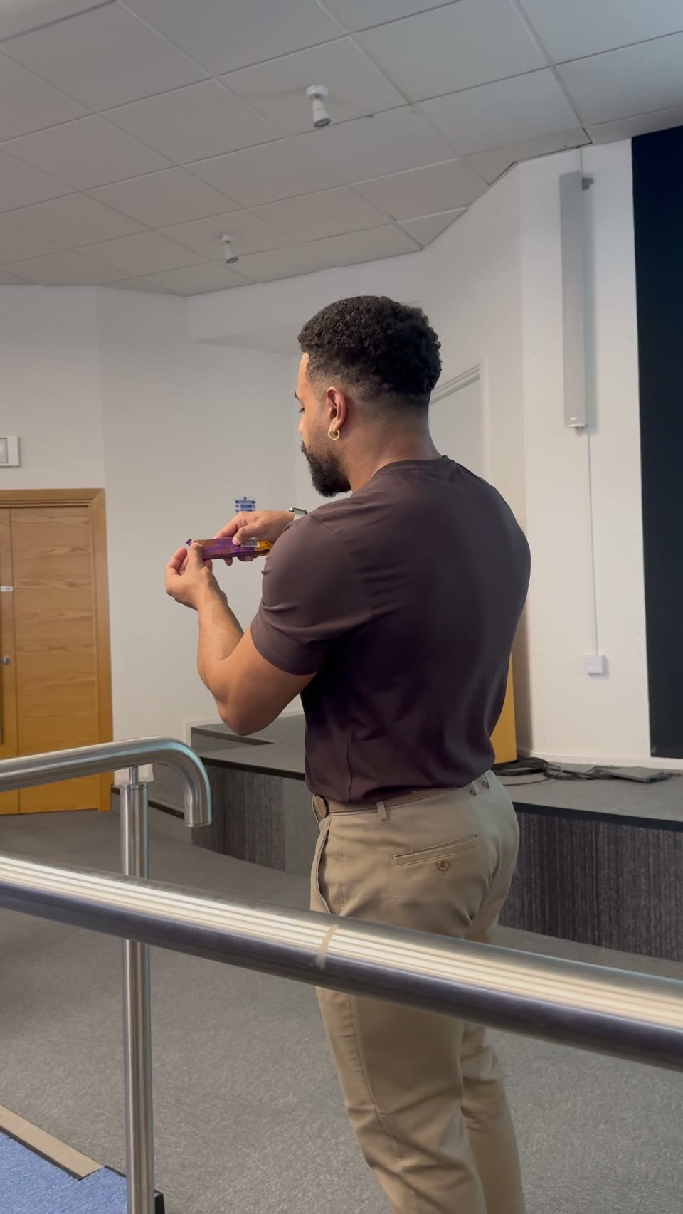 Leon Ramos examining a packaged snack during the seminar